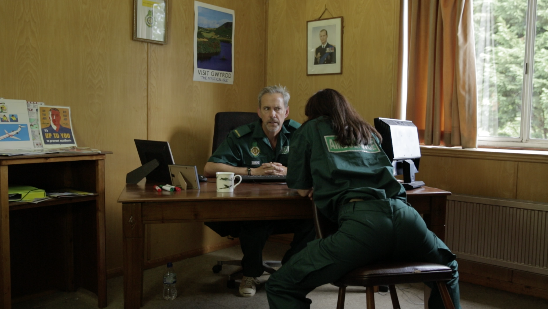 Gwyrdd Ambulance CEO in deep discussion with his Operations Manager